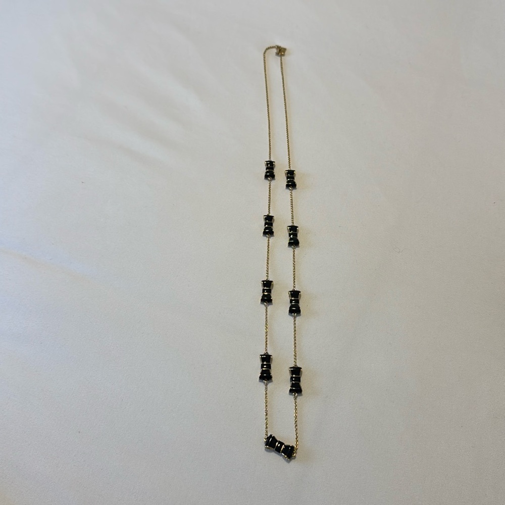 Kate Spade necklace, gold with black bows